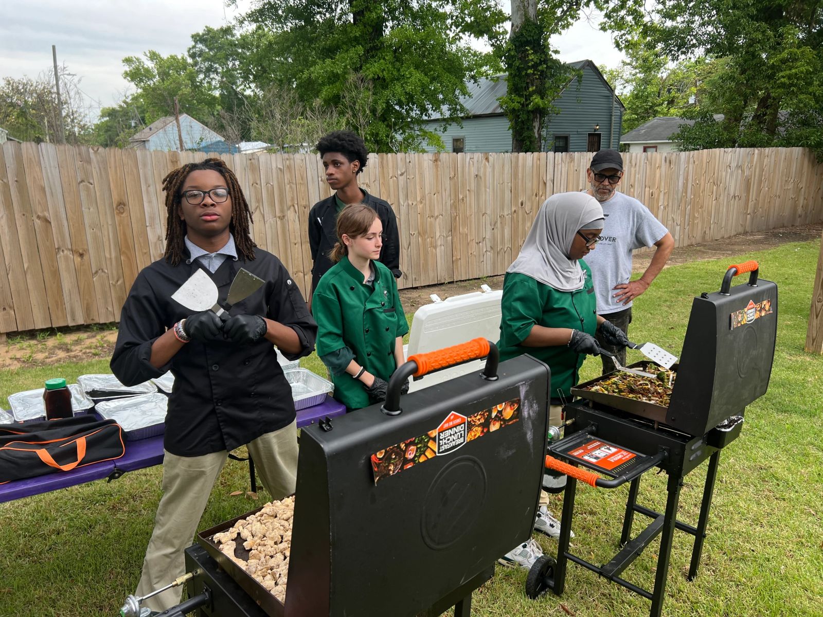Volunteers tending the community garden in Africatown