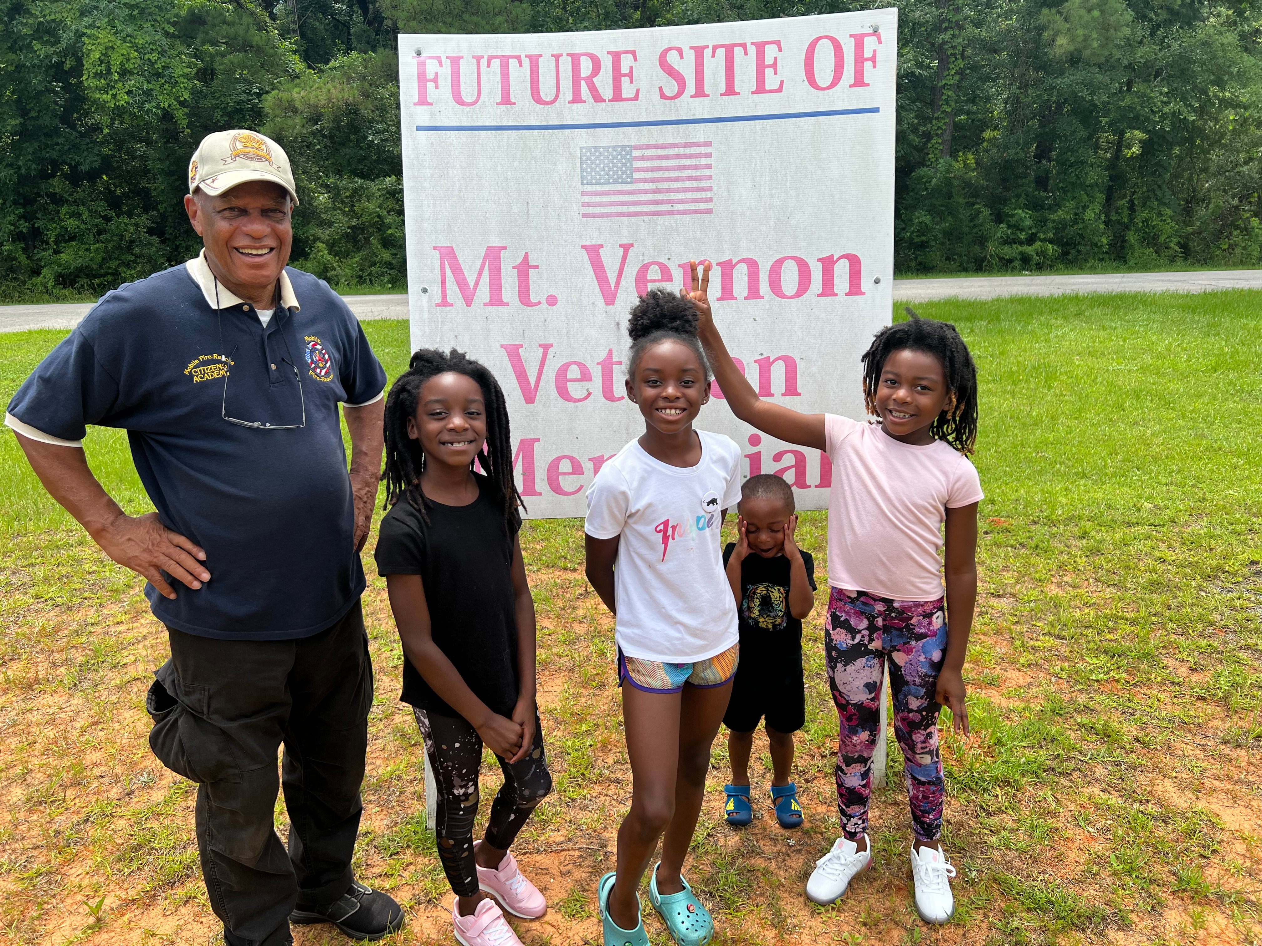 A Fire-Rescue Citizens Academy volunteer with children at the future site of the Mt. Vernon Veteran Memorial